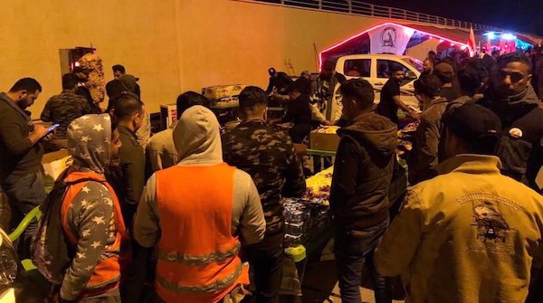 In pictures: Iraqis converge on Baghdad airport to remember Soleimani, Muhandis on assassination anniv.