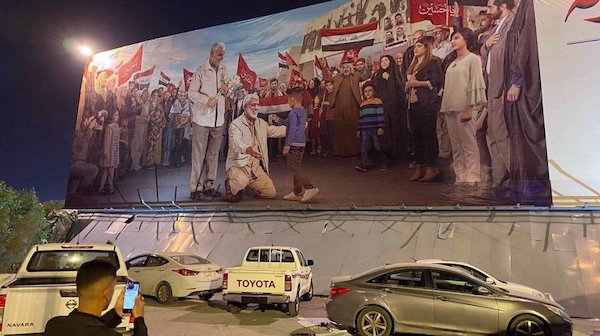 In pictures: Iraqis converge on Baghdad airport to remember Soleimani, Muhandis on assassination anniv.