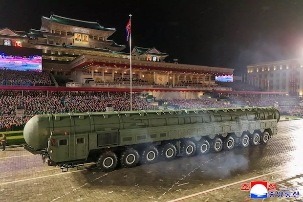 North Korea displays new long-range missile at a military parade celebrating Kim Jong Un