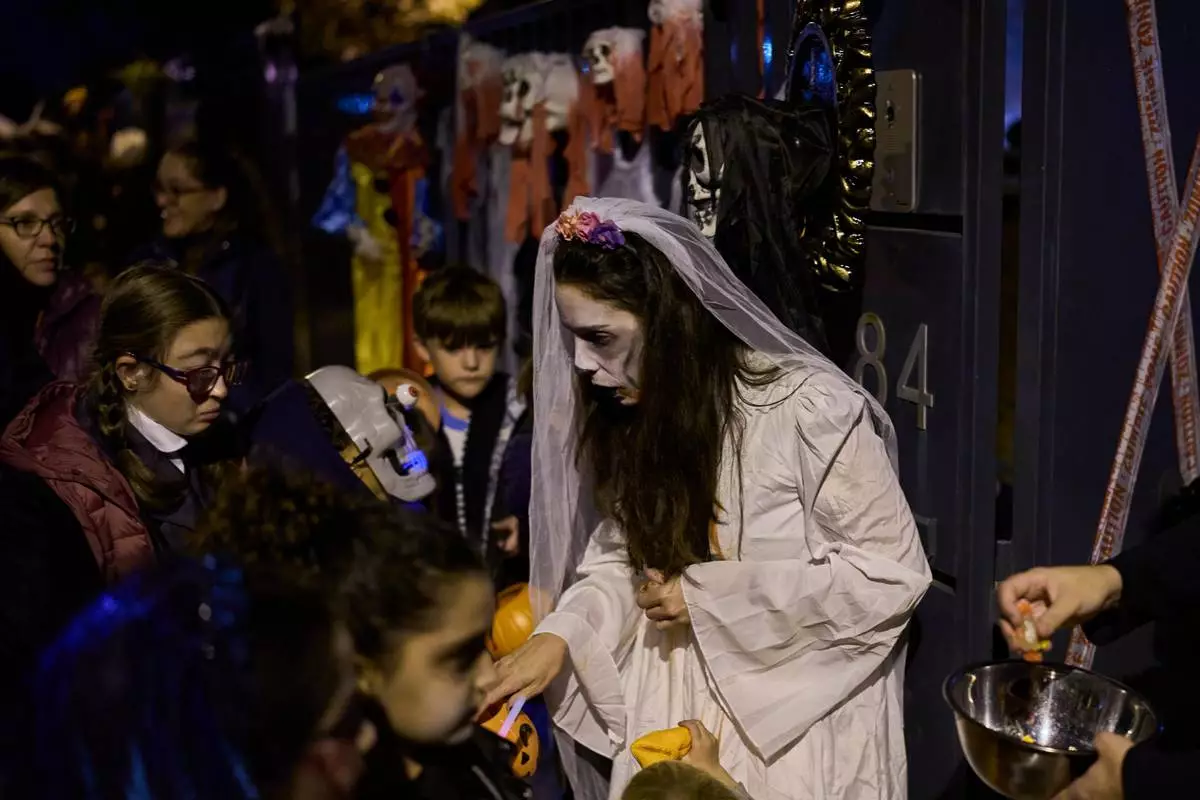 Halloween and a declining Christian tradition coexist on All Saints` Day in Spain