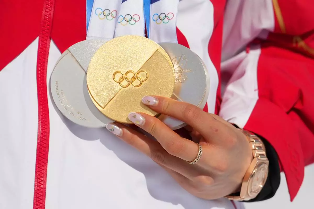 Eileen Gu in tears after defending her Olympic halfpipe title, learning of her grandmother’s death