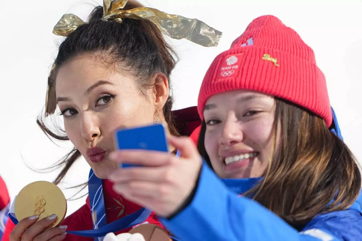 Eileen Gu in tears after defending her Olympic halfpipe title, learning of her grandmother’s death
