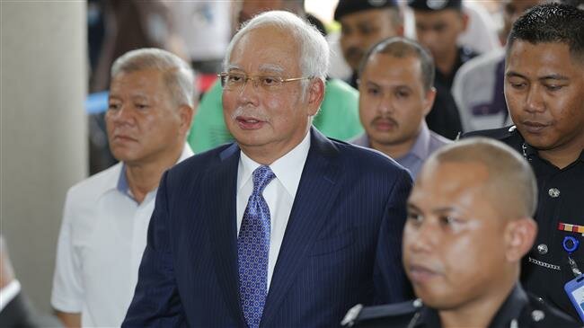 Malaysias ex-PM pleads not guilty as graft trial begins
