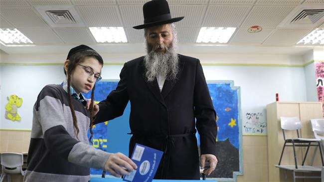 Israelis voting in general elections, with main contenders neck and neck