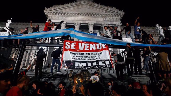  New Argentine presidents first economic shake-up plan sparks protests